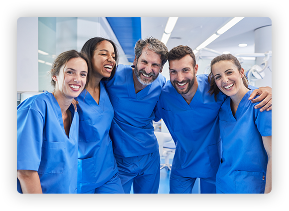 photo of a group of nurses huddled together for a picture in their scubs