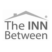 The logo shows a gray roof shape above the words "The INN Between" in bold, with a registered trademark symbol in the upper right corner.