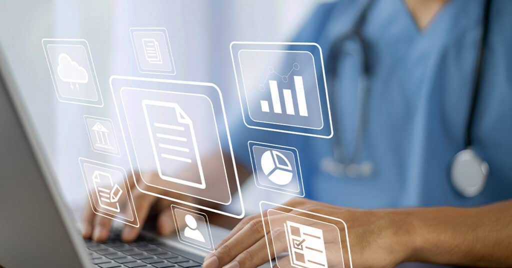A person in medical scrubs uses a laptop, with digital healthcare and data icons superimposed in the foreground.