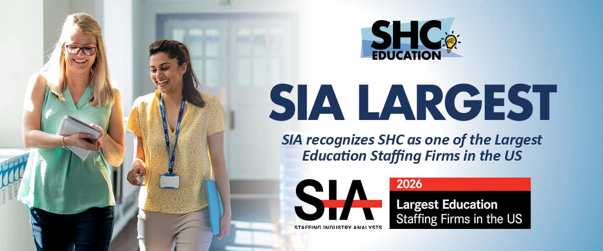 Two women walk together in an office; text highlights that SHC is recognized by SIA as one of the largest education staffing firms in the US.